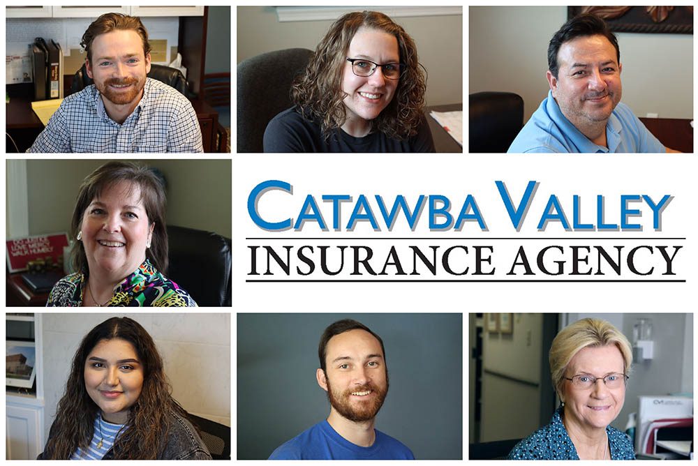 About Us - Catawba Valley Insurance Agency Team Smilling at Their Desks in the Office